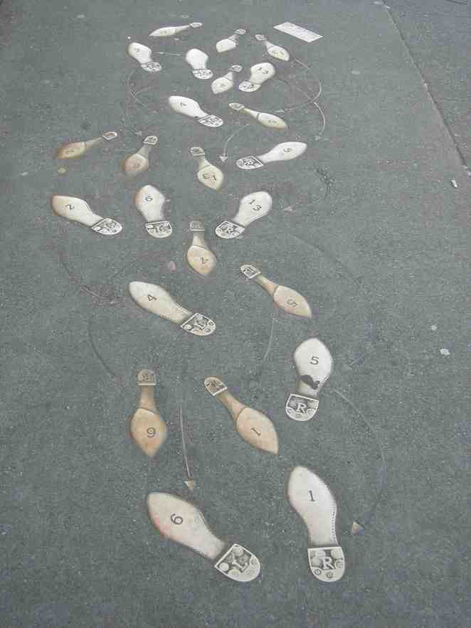Mambo dance steps inlaid into the sidewalk of Broadway, Capitol Hill, Seattle, Washington.